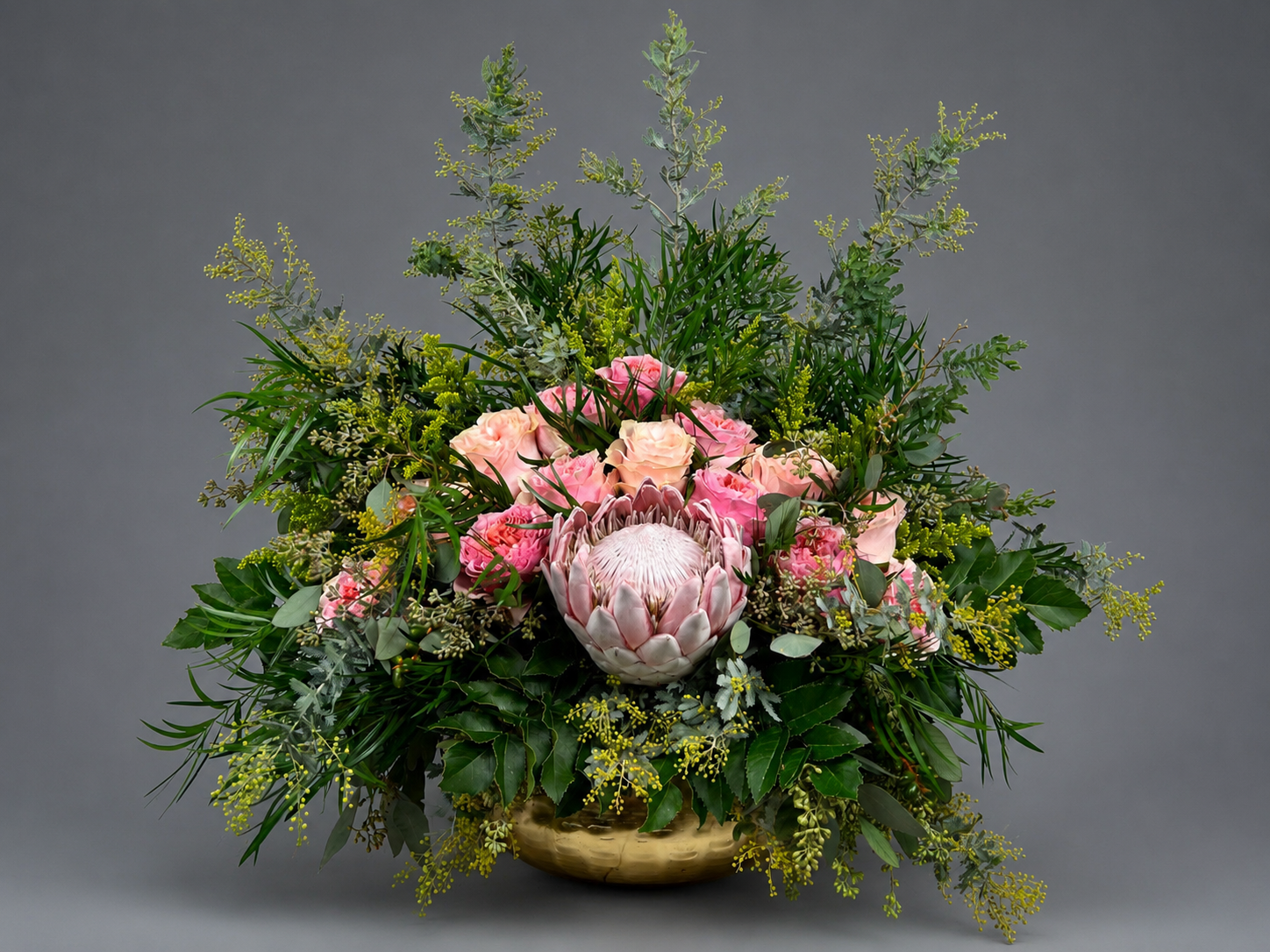 Large sculptural floral centerpiece on black velvet