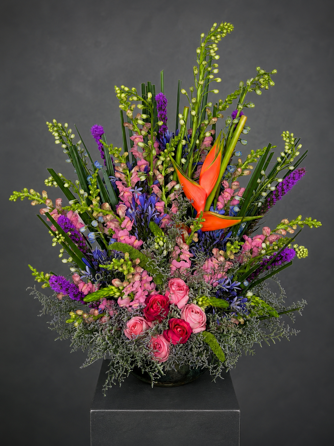 Large sculptural floral centerpiece on black velvet